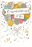In this image, a stylish congratulations card is displayed, its design echoing the gentle excitement of celebrating good news around Queen's Park on a bright day. The central artwork is a cluster of illustrated balloons that gather and rise through the middle of the card, overlapping to create a rich, layered effect. Each balloon is coloured in a carefully chosen palette of metallic gold and silver, champagne, sky blue, blush pink, and soft grey, giving the grouping a modern yet timeless charm. Fine details bring each balloon to life: some surfaces are dusted with subtle glitter, others are traced with tiny stars, delicate stripes, or neat little dots, giving an impression of confetti caught in mid-air, like you might see at a party near Salusbury Road. From their bases, thin gold and silver ribbons flow downward in loose, curling shapes, crossing and entwining as they fall towards the bottom of the card, forming a graceful tangle that anchors the airy design. Cutting across the centre of the balloons is a slightly curved banner, its ends gently unfurling and its face carrying the words Congratulations To You in elegant, looping calligraphy that feels personal and heartfelt. Around this central motif, the pale background is sprinkled with tiny metallic stars, specks, and swirling confetti lines, adding a sense of joyous motion and light. The overall effect is of a polished yet playful celebration, perfectly suited to accompany a bouquet delivered to a home off Brondesbury Road or a small gathering near the park. It conveys pride, admiration, and happiness, ideal for marking occasions such as graduations, promotions, passed exams, or any moment when someone deserves to feel truly celebrated.